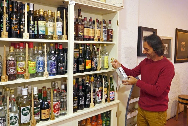 Roberto Andrade, who runs the Madeira Rum House, poses with his collection of rums in Funchal, Portugal, on Dec. 8, 2017.