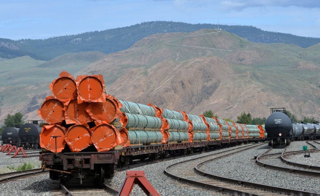 Steel pipe to be used in the oil pipeline construction of Kinder Morgan Canada's Trans Mountain Expansion Project sit on rail cars at a stockpile site in Kamloops, B.C., on May 29, 2018.