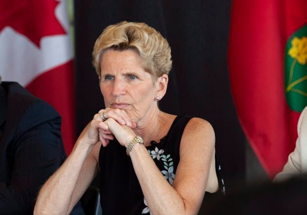 Ontario Liberal Party Leader Kathleen Wynne listen to students at the University of Waterloo during a campaign stop in Waterloo, Ont., on Friday.