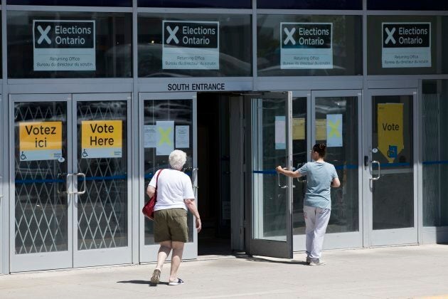 People arrive to vote early in the Ontario election in Kingston, Ont. on May 29, 2018.