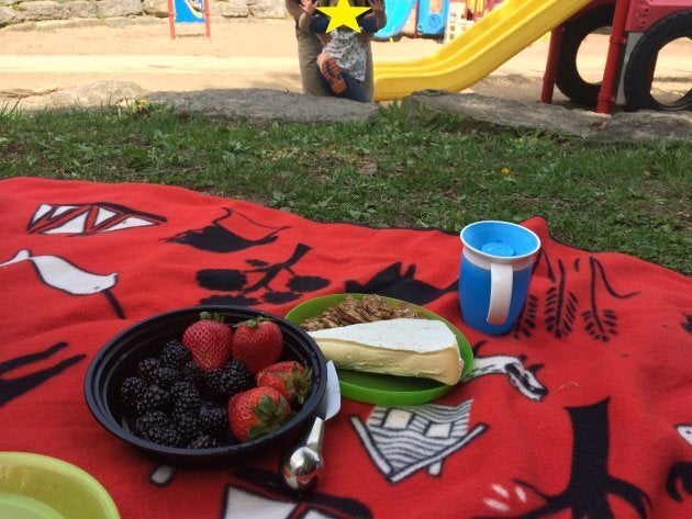 The author's toddler catching wind of snacks that weren't supposed to be for him during a recent picnic at the park.