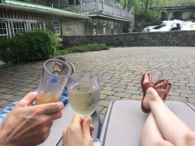 The author and her husband enjoying some rare alone time on a patio while discussing how perfect their child is.