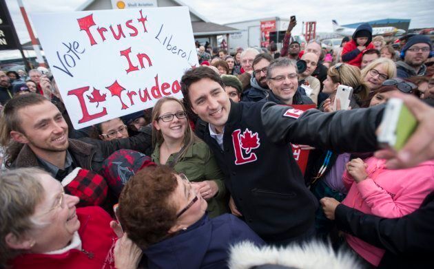 Liberal Leader Justin Trudeau takes a selfie with supporters at a campaign rally in Thunder Bay, Ont., on Oct. 17, 2015.