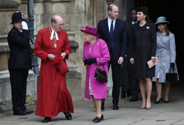 Dean of Windsor, David Conner, and the Queen exit as the Duke and Duchess of Cambridge follow after the Easter Service at St. George's Chapel.