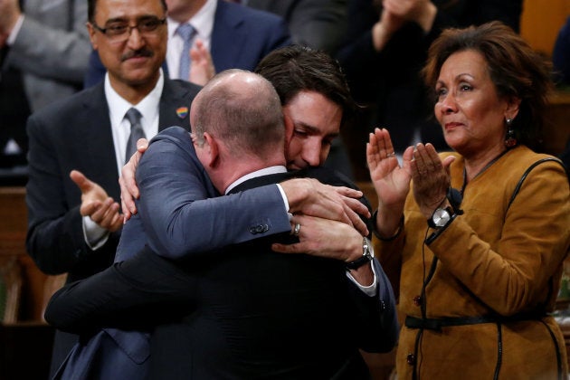 Prime Minister Justin Trudeau hugs Liberal MP Randy Boissonnault, Special Advisor to the Prime Minister on LGBTQ2 issues, after delivering an apology to members of the LGBT community in the House of Commons on Parliament Hill in Ottawa on Nov. 28, 2017.