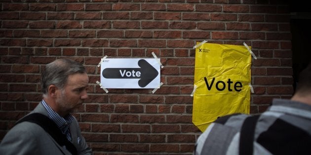 Voters line up to cast a ballot in the Ontario provincial elections in Toronto on June 7, 2018.