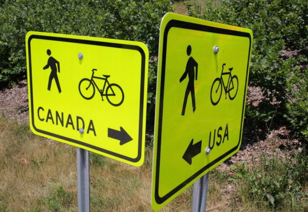 Signs pointing to pedestrian and cycle routes are seen outside a Canada Border Service Agency crossing at the Peace Bridge in Fort Erie, Ont.