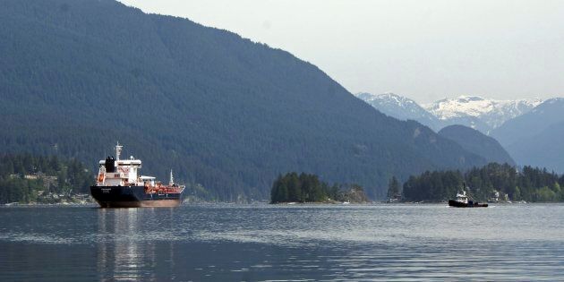 This May 3, 2018 photo shows the Kirkeholmen oil tanker anchored outside the Kinder Morgan Inc. Westridge oil terminal in Vancouver, at the end of the Trans Mountain pipeline that begins in northern Alberta.