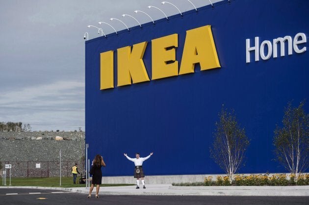 A man in a kilt poses in front of the new IKEA store in Halifax on Sept. 25, 2017.