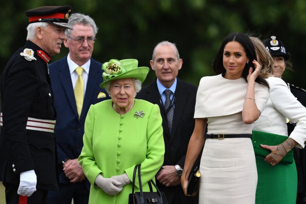 Queen Elizabeth II and Markle arrive to open the new Mersey Gateway Bridge on June 14.