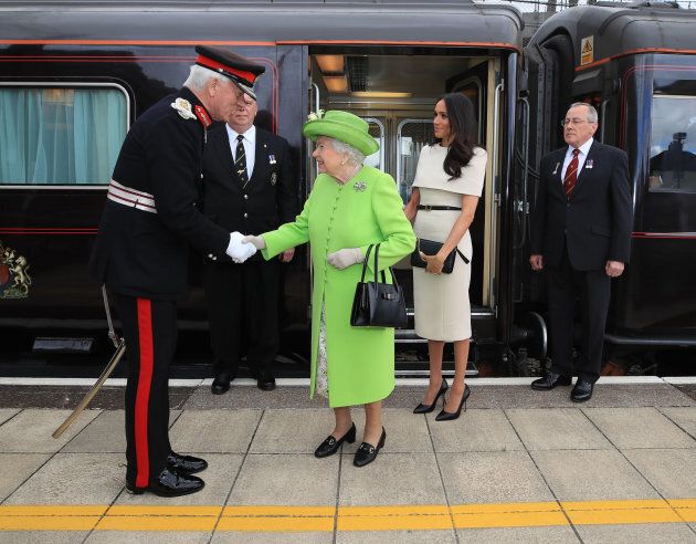 Queen Elizabeth II and the Duchess of Sussex as they arrive by royal train at Runcorn Station.