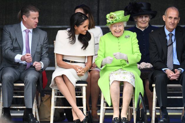 Queen Elizabeth II laughs with Markle during a ceremony to open the new Mersey Gateway Bridge on June 14.