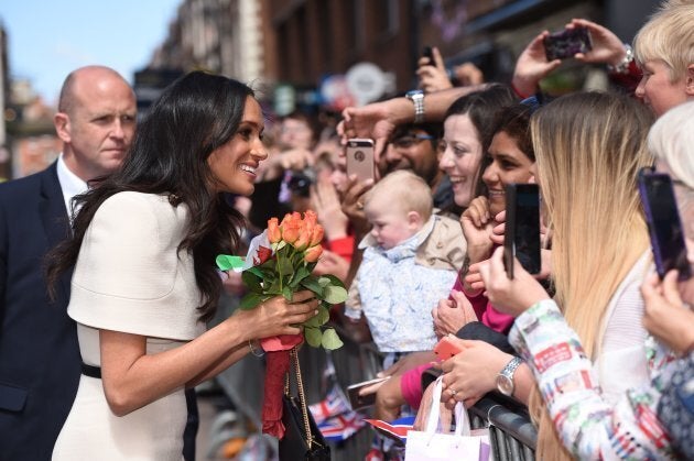 The Duchess of Sussex greets well-wishers during her visit to Chester on June 14.