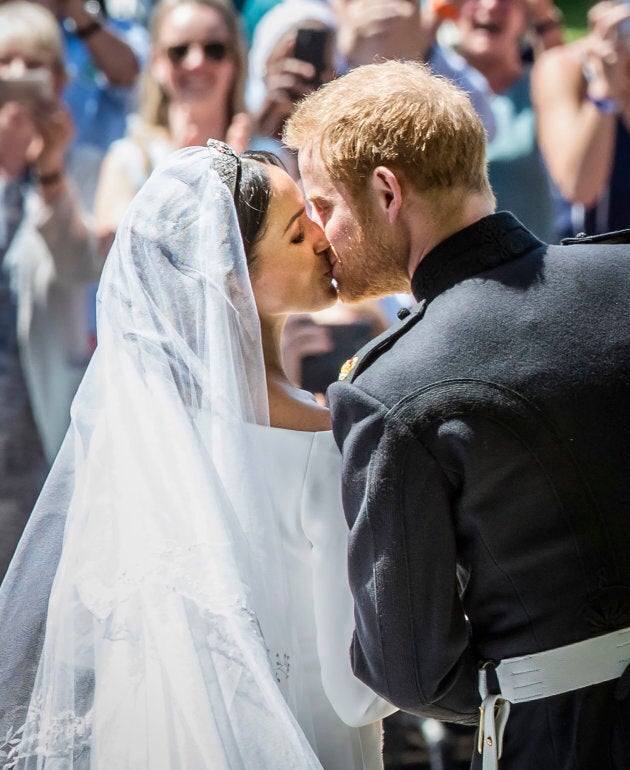 Prince Harry and Meghan Markle kiss on the steps of St George's Chapel in Windsor Castle after their wedding on May 19.