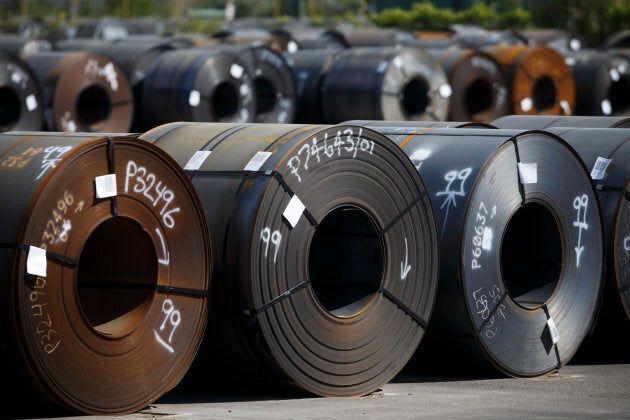 Steel coils lay in a yard at ArcelorMittal Dofasco steel plant on June 4, 2018 in Hamilton, Ont.