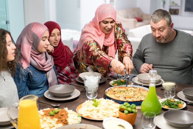 Muslim family waits for Iftar food during Ramadan.