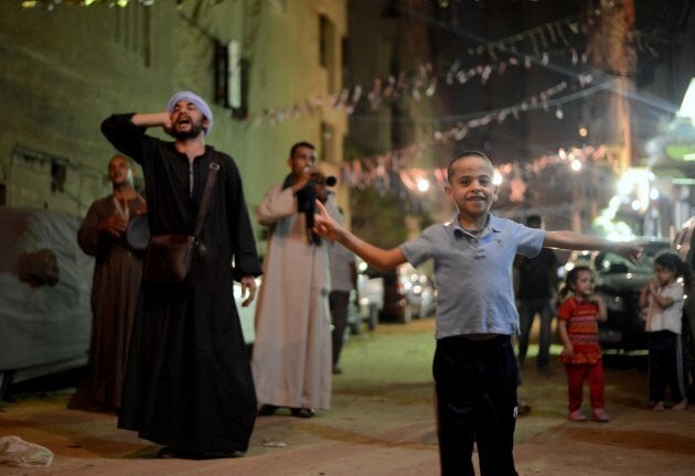 Traditional dawn awakeners known as "mesaharati" beat drums and chant religious songs to wake up Muslims during the holy month of Ramadan in Cairo, Egypt on June 14, 2016.