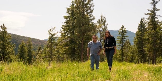 Angie Kane and Chief Larry Fletcher walk along the 17 acres of land they purchased from private landowners to house the High Bar First Nation’s band office, near Clinton B.C.