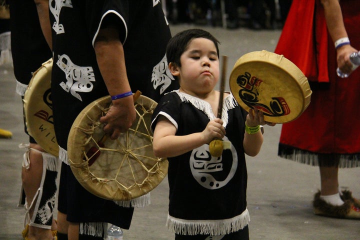 A child plays a drum as Nisga'a citizens gather during the celebration of Hobiyee, the First Nations New Year in Vancouver, on Feb. 4, 2018.