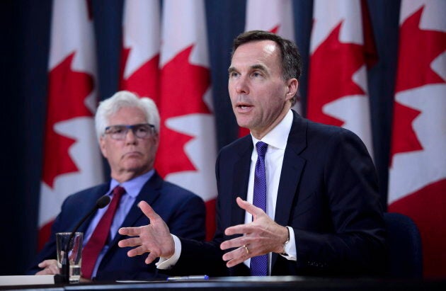 Finance Minister Bill Morneau and Natural Resources Minister Jim Carr speak at the National Press Theatre during a press conference in Ottawa on May 29, 2018.