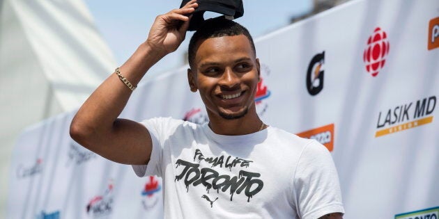 Olympic medallist Andre De Grasse delivers remarks prior to a street exhibition of track and field at Nathan Phillips Square in Toronto on Tuesday, June 12, 2018.