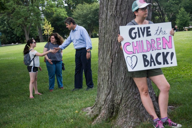 Dr. William Kennedy Smith greets attendees of a rally on the East Front lawn of the Capitol to condemn the separation and detention of families at the border of the United States and Mexico on June 21, 2018.