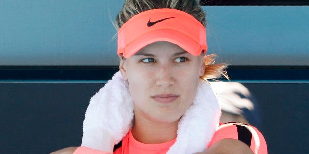 Eugenie Bouchard of Canada rests with iced towels around her shoulders during a break in her match against Oceane Dodin of France in January 2018.