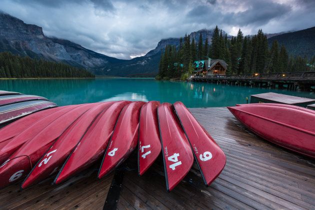 Red canoes on the dock of Emerald Lake in Yoho National Park, B.C.