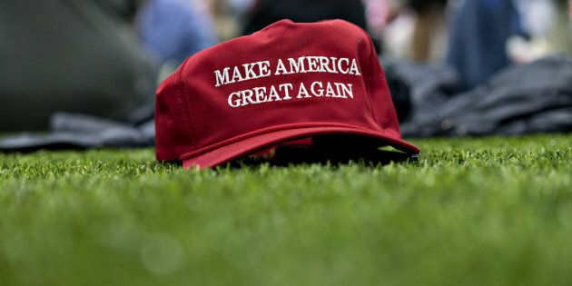 A 'Make America Great Again' hat sits on the ground ahead of a speech by U.S. President Donald Trump during a rally in Michigan, on April 28, 2018.