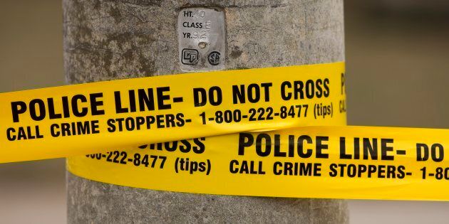 Police tape is shown in Toronto.