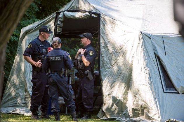 Police investigate a property along Mallory Cres. in Toronto as part of the Bruce McArthur investigation on Wednesday.