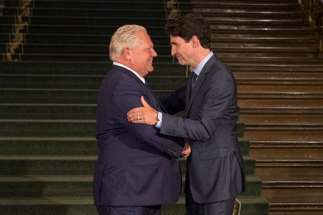 Ontario Premier Doug Ford greets Canadian Prime Minister Justin Trudeau at the Ontario Legislature, in Toronto on July 5, 2018.