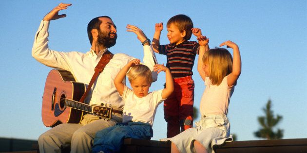 Raffi Cavoukian, better known by Raffi, entertains some children after a concert Sept. 10, 1989 in Los Angeles, California.
