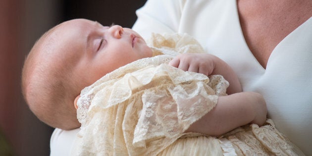 Prince Louis asleep in the Duchess of Cambridge's arms on the day of his christening.