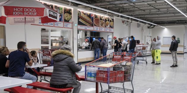 Customers line up for ready cooked food at the cafe inside a Costco Wholesale Corp. store in Villebon-sur-Yvette, France, on Friday, Nov. 3, 2017.