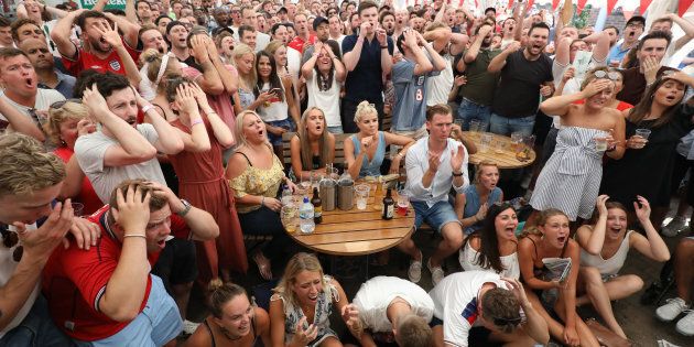 Fans react to a near miss from England while watching coverage of the FIFA World Cup 2018 quarter-final match between Sweden and England at the Rose & Crown pub in Wimbledon, south London.