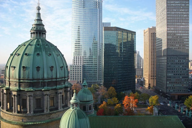 Autumn picture of the dome of the Cathedrale Marie-Reine-du-monde and modern highrise office buildings in Montreal.