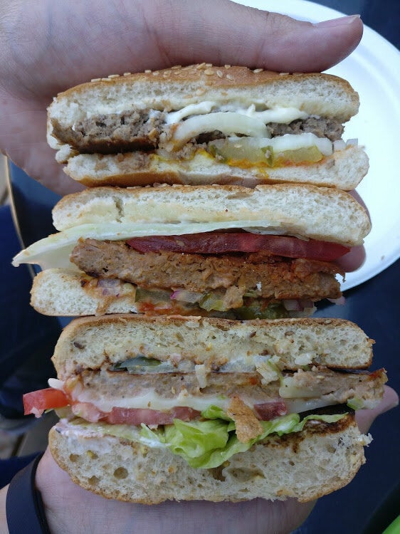 Can you guess which burger is which? From top to bottom: A&W's Mama burger, the Beyond Meat burger, and the Veggie Deluxe burger.