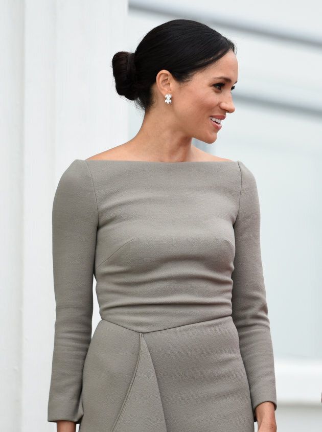 The Duchess of Sussex wearing a chic dress by Roland Mouret and Birks earrings.