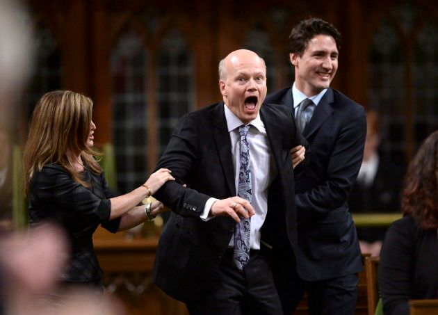 Newly-elected Speaker of the House Geoff Regan jokingly resists as he's escorted to the Speaker's chair by former interim Conservative leader Rona Ambrose and Prime Minister Justin Trudeau in the House of Commons on Dec. 3, 2015.