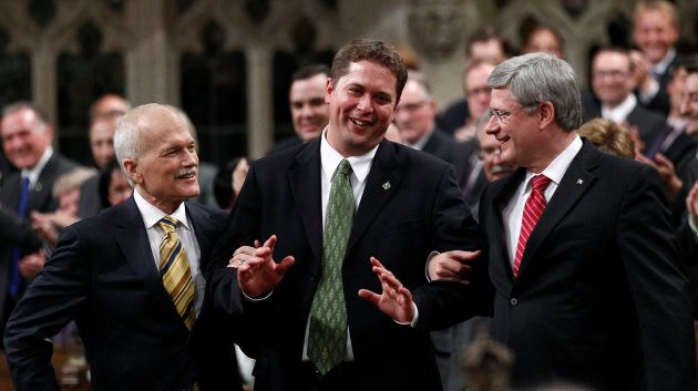 Former prime Minister Stephen Harper and former NDP leader Jack Layton lead Andrew Scheer to the Speaker's chair on June 2, 2011.