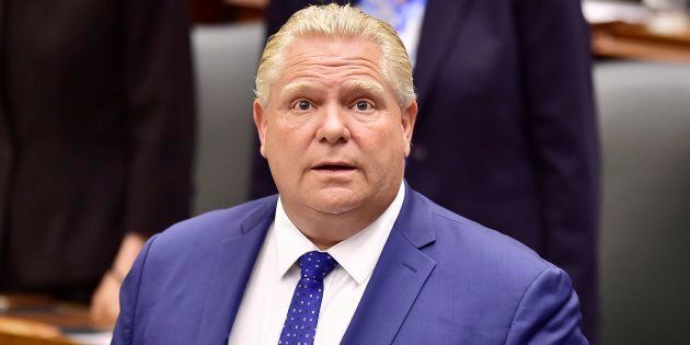 Ontario Premier Doug Ford applauds as Lt.-Gov. Elizabeth Dowdeswell delivers the speech from the throne to open the new legislative session at the Ontario Legislature at Queen's Park in Toronto on June 12, 2018.
