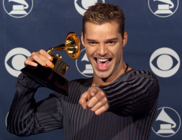 Singer Ricky Martin poses with his Grammy Award for Best Latin Pop Performance for "Vuelve" at the Shrine Auditorium on Feb. 24 at the 1999 Grammy Awards in Los Angeles.