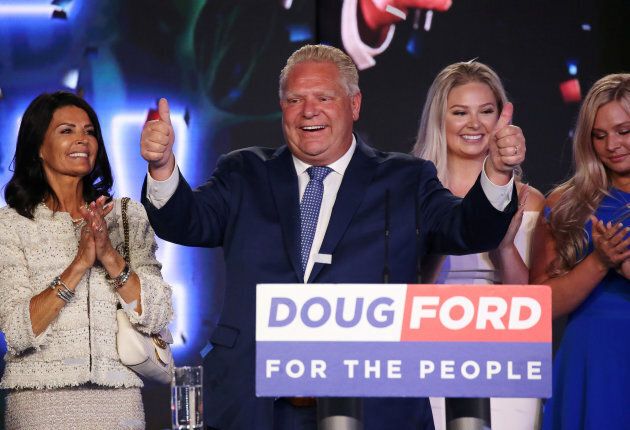 Progressive Conservative leader Doug Ford attends his election night party with his wife Karla Ford and their daughters following the provincial election in Toronto on June 7, 2018.