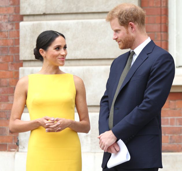 Meghan Markle in a yellow Brandon Maxwell sheath dress with a modified boatneck, with husband Prince Harry, at the Your Commonwealth Youth Challenge reception in London.
