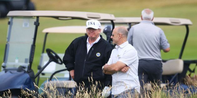U.S. President Donald Trump waits on the 4th tee at Turnberry golf course Scotland on Saturday.
