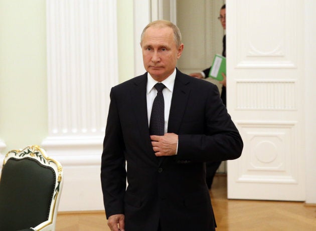 Russian President Vladimir Putin enters the hall during his meeting with President of Gabon Ali Bongo Ondimba (not pictured) at the Kremlin, in Moscow on Saturday.