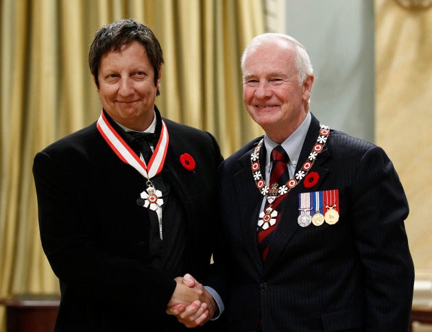 Actor, playwright and director Robert Lepage, left, shakes hands with Governor General David Johnston after being awarded the rank of Companion in the Order of Canada at Rideau Hall in Ottawa November 4, 2011.