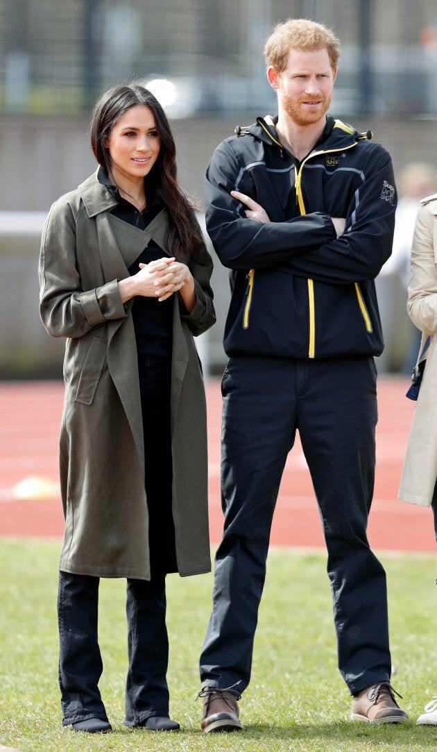 Meghan Markle, wearing an Aritzia trench coat, with Prince Harry at the UK trials for the 2018 Invictus Games on April 6.