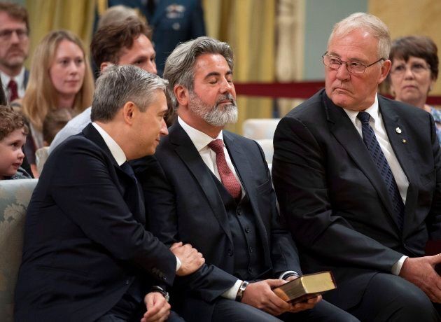 Liberal MPs Francois-Philippe Champagne, Pablo Rodriguez and Bill Blair are seen at a swearing-in ceremony at Rideau Hall in Ottawa on July 18, 2018.